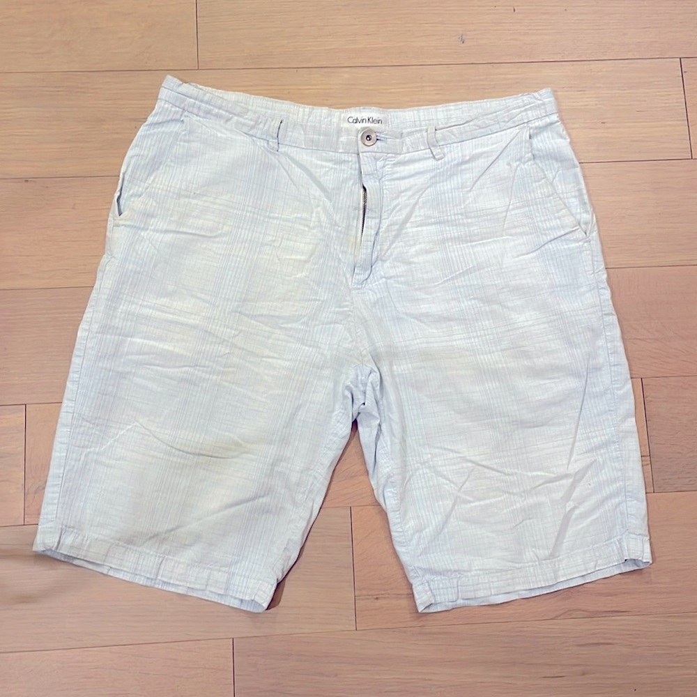 Blue & white lightly striped Calvin Klein shorts men’s size Large/has a 36 waist
